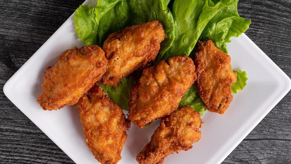 Buffalo Wings · Chicken wings breaded, deep fried and tossed in buffalo wing sauce.  Served with homemade ranch dressing.