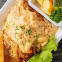 Redfish · Grilled Redfish, topped with a creamy crawfish sauce