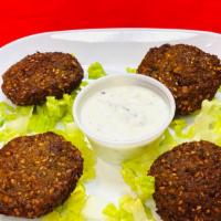 Falafels · A worldwide recognized Mediterranean food. Deep-fried chickpeas and traditional spices. Serv...