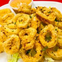 Calamari · Lightly battered, flash-fried calamari slightly dusted in black pepper and served with dippi...