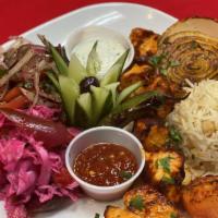 Chicken Kebab  · Gluten free. Skewered, charbroiled cubes of seasoned
chicken breast served with onion salad,...