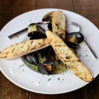 Prince Edward Island Mussels · white wine citrus butter broth, basil, grape tomato, fennel and baguette