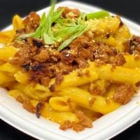 Mac & Cheese · Penne noodles, house cheese, bacon bits, garlic aioli drizzle, cashew Parmesan.