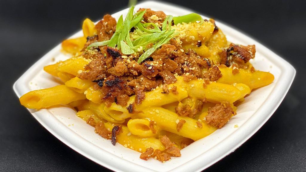 Mac & Cheese · Penne noodles, house cheese, bacon bits, garlic aioli drizzle, cashew Parmesan.