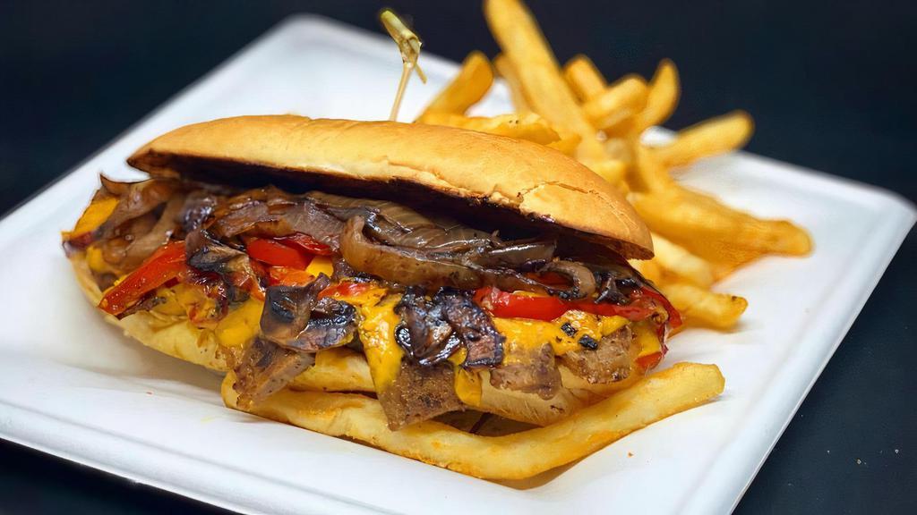 Philly Cheesesteak · House seitan, cheese sauce, red bell peppers, mushrooms, grilled onions, hoagie roll.