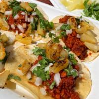 Al Pastor Tacos  · textured veggie protein, soyrizo, pineapple, diced onions, cilantro, house al pastor sauce, ...