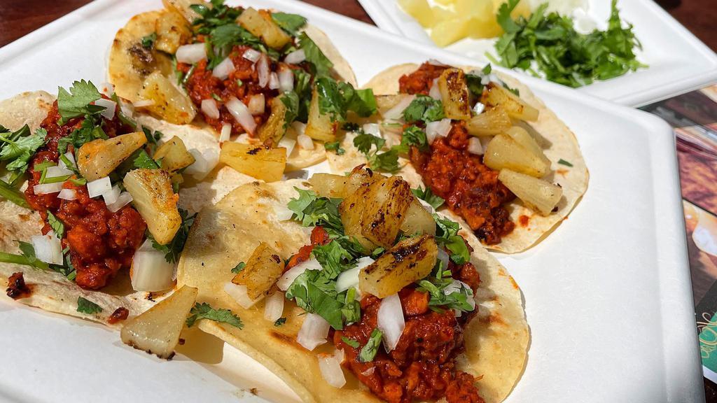 Al Pastor Tacos  · textured veggie protein, soyrizo, pineapple, diced onions, cilantro, house al pastor sauce, corn tortillas