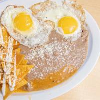 Chilaquiles Verdes · Green Sauce,  with beans and a choice of meat or eggs.