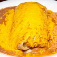 Txst Burrito · Large tortilla filled with your choice of meat, tomato, sour cream with gravy and cheese on ...