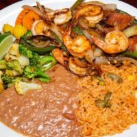 Camarones A La Mexicana · Grilled shrimp with jalapeños, onions, tomatoes, and ranchero sauce. Served with rice, refri...