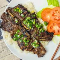 Grilled Beef Short Ribs On Broken Rice/ Cơm Sườn Bò Nướng X · Grilled lemongrass beef short rib with steamed rice.