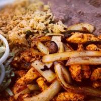 Beef/Chicken Fajitas · Mexican style fajitas, served with rice, beans, guacamole, and sour cream.