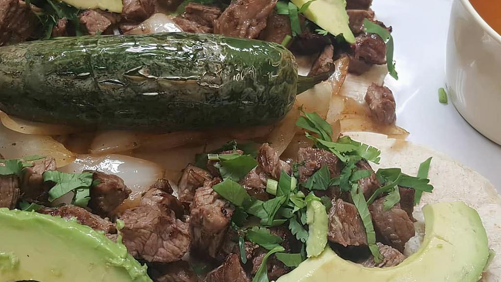 Street Tacos · Four small tacos with your choice of meat: beef fajita, chicken fajita, barbacoa or pastor; served with cilantro, grilled onions, sliced avocados and charro beans