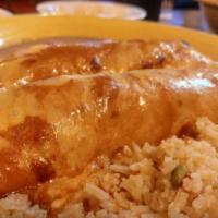 Two Fajita Enchiladas · Served with rice and beans.