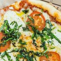 Margherita Pizza · Sauce, cheese, tomato, fresh sliced mozzarella, and basil olive oil.