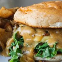 Breakfast Sandwich · JUST egg patty covered with sausage crumbles, golden gravy with tomato & arugula on a maple-...
