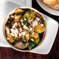 Brussels Sprouts · Tamari Brussels with sweet onions topped with slivered almonds. Served with house Spicy Aioli