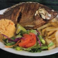 Mojarra Frita · Fried whole tilapia served with rice, salad & french fries.