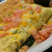 Veggie Omelette · Broccoli, diced bell pepper, mushrooms, onions and tomatoes.