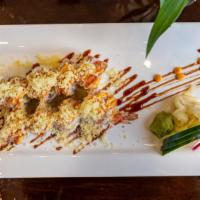 Shaggy Dog Roll · Cream cheese and shrimp tempura wrapped inside, with crab meat on top, and served with spicy...