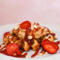Pb N' J · Toasted Belgian waffle with peanut butter icing, strawberry jam, fresh strawberries and toas...