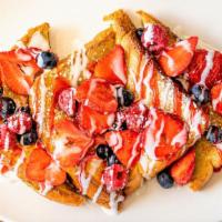 Strawberry French Toast · Our signature french toast topped with fresh strawberries and whipped cream.