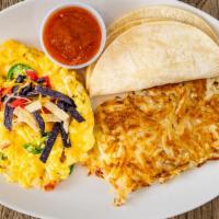 Migas · Scrambled eggs with tortilla strips, jalapeños, tomatoes and onions topped with aged cheddar...