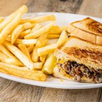 Sourdough Beef Melt · Shaved beef, grilled onion and mushrooms with monterey jack and cheddar cheeses on grilled s...