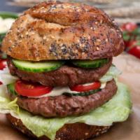 Double Burger · Two, juicy, grilled 1/4 pound all beef patties topped with fresh lettuce, tomato and onions ...