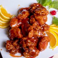 Orange Chicken · Spicy. Chicken lightly battered and served with orange peels and hot pepper sauce.