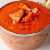 Paneer Butter Masala · Cottage cheese cooked in butter cream and rich tomato gravy. Comes with steamed rice.