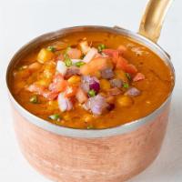 Channa Masala · Curry made with chickpeas and blend of indian spices. Comes with steamed rice.