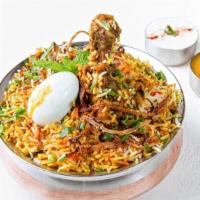 Hyderabad Dum Biryani · Veggies, Chicken or Goat cooked in basmati rice with special herbs and spices; served with r...