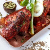 Tandoori Chicken · Whole chicken marinated in a spice rub and slow cooked in the tandoor