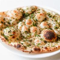Garlic Naan · Indian flatbread flavored with garlic & butter