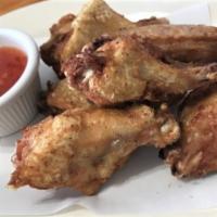 Chicken Wings (6) · Chicken wings marinated with a blend of spices and lightly fried served with our sweet chili...