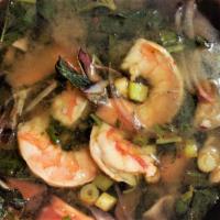 Tom Yum Goong · Spicy and sour Thai soup with shrimp, galangal, lime leaves, basil, cilantro, lemongrass, mu...