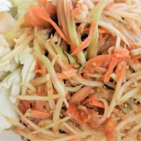 Thai Papaya Salad · Shredded green papaya and carrots tossed with Thai chili peppers, garlic, tomatoes, and crus...