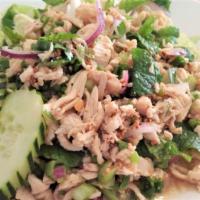Larb Gai · Chicken with mint, green onion, cilantro, and toasted rice powder served with lettuce and cu...