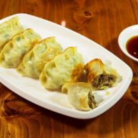 Pan Fried Dumplings · Chicken and vegetable dumplings seared to a crispy, golden brown. Available steamed.