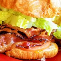 Bruce Lee Blt · Bacon, cheddar, romaine and tomatoes with house-made chipotle mayo on a toasted croissant or...