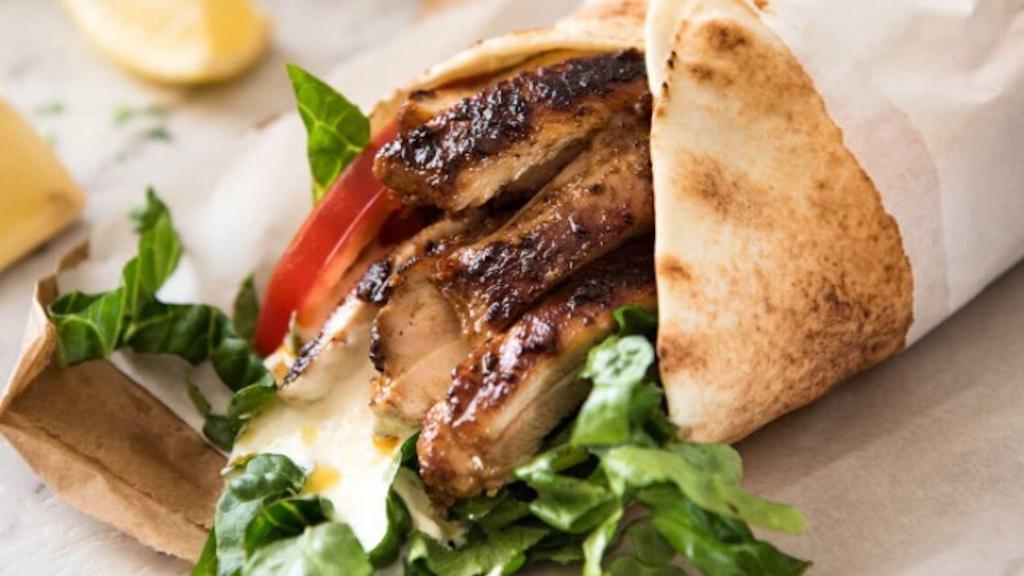 Chick-Licious Shawarma Wrap · Roasted chicken breast marinated with herbs and spices, with lettuce , tomato, onion, pickles, garlic. tzatziki and chef sauce