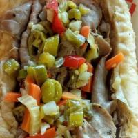 Italian Beef · French bread filled with thinly sliced seasoned beef, dipped in its own juice, topped with h...