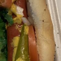 Chicago Style Hotdog · Vienna beef on poppy seed bun, topped with mustard, onions, tomato, relish, pickle, and spor...