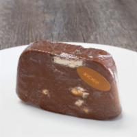Snickers Fudge · Half-pound slice of rich, smooth, and creamy chocolate fudge mixed with peanuts and Snickers...