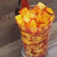 Mango Fiesta · Fresh cut mango chunks topped with Chamoy + Lime Juice + Tajin + Tamarindo Straw