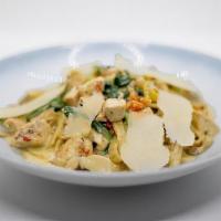 Chicken & Spinach Tagliatelle · House-made tagliatelle pasta, roasted chicken, pesto cream sauce, fresh spinach, sun-dried t...
