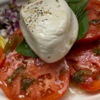 Burrata & Tomatoes · Mozzarella Cheese Filled with Cream.  Extra Virgin Olive Oil & Fresh Basil Served with Red O...