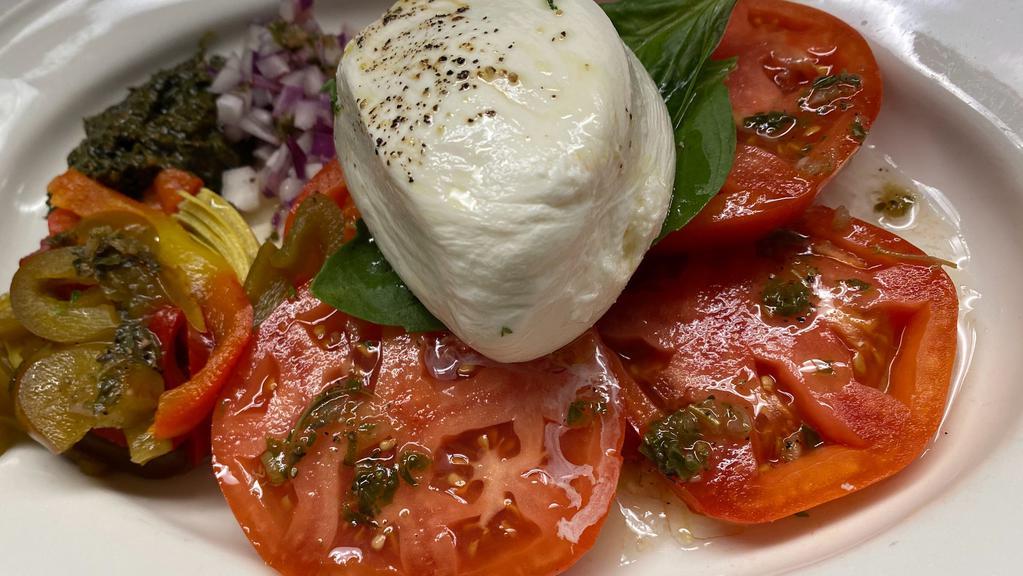 Burrata & Tomatoes · Mozzarella Cheese Filled with Cream.  Extra Virgin Olive Oil & Fresh Basil Served with Red Onions, Pesto, Red Bell Peppers.