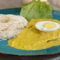 Aji De Gallina · A combination of shredded chicken cooked with our aji amarillo. Served with white rice, oliv...